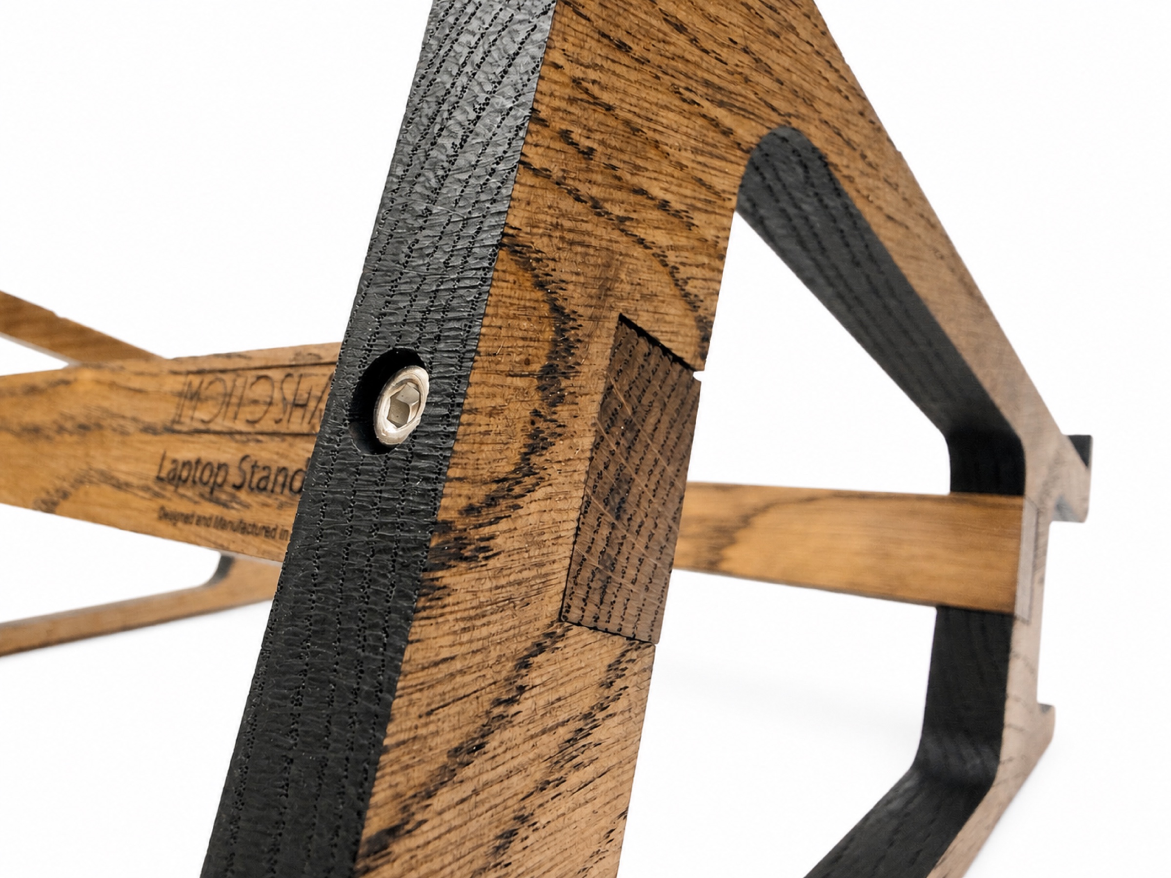 Detail of the shaped oak frame and connection of a MONOSHAPE MacBook stand